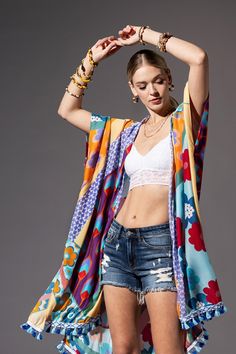 Introducing our special textured kimono, blending floral and geometric prints for a cool, eye-catching design. Made from super comfy fabric, it feels as good as it looks. Stand out from the crowd with this unique piece that adds a stylish twist to any outfit. *100% Viscose*APPROX. L 40 " W 38" Chic Multicolor Floral Print Kimono, Chic Floral Print Kimono For Vacation, Chic Floral Print Kimono For Spring, Chic Long Floral Print Kimono, Summer Kimono With Abstract Print, Spring Kimono With Abstract Print, Floral Print Kimono For Spring Festival, Colorful Patterned Spring Kimono, Spring Festival Kimono With Vibrant Print