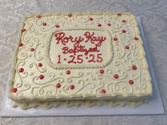 a white cake with red writing on it