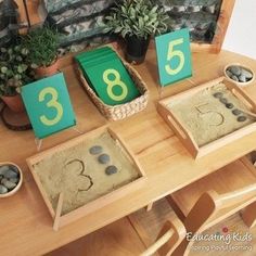 the table is set up with numbers and rocks