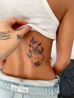 a woman's stomach with butterflies on it