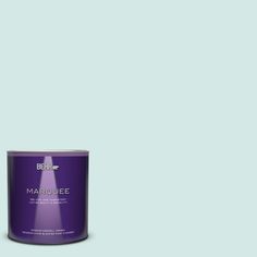 a can of marquee paint on a green background