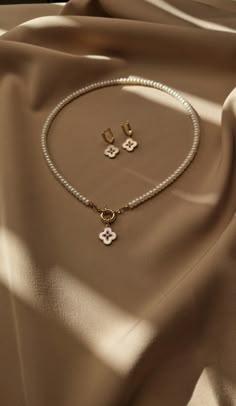 "Step into elegance with our exclusive jewelry set, which includes a pearl choker and clover-themed earrings. The aesthetic necklace features an old money aesthetic, beautifully detailed with a good luck charm clover pendant. Complementing the daintly necklace are the delicately crafted gold plated clover earrings that bring a touch of grace and finesse to any outfit. 🍀 This set is a perfect gift for the remarkable women in your life. Whether it's showing appreciation to your mom, celebrating a sister's milestone, surprising your bestie, or romancing your girlfriend, this set serves as a thoughtful and luxurious gesture. It's an ideal present for special occasions such as birthdays, anniversaries, or simply as a way to say \"I care.\" SET INCLUDES - Earrings - Pendant Necklace DETAILS ♦️ Jewelry Old Money Aesthetic, Jewelleries Aesthetic, Old Money Necklace Aesthetic, Old Money Aesthetic Jewelry, Old Money Jewellery, Old Money Jewelry Aesthetic, Old Money Earrings, Old Money Necklace, Old Money Accessories