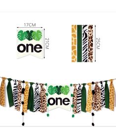 the one banner is decorated with giraffes, zebra print and green leaves