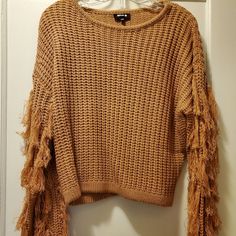 This Somewhat Cropped Sweater Is More Of A Rust Color Vs Orange. It's Very Pretty - Never Worn. This Is A Small/Medium And The Length From Shoulder To Bottom Of Front Is 21". Pit To Pit Is: 21" Length Of Sleeve: 21". Fall Knit Tops With Fringe, Knit Fringe Top For Fall, Knit Top With Fringe For Fall, Casual Knit Top With Fringe, Trendy Fringe Tops For Winter, Brown Fringe Tops For Fall, Brown Fringe Top For Fall, Rust Color, Cropped Sweater