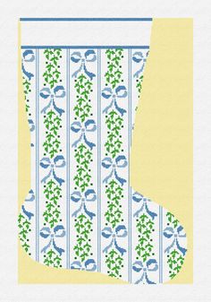 a cross stitch christmas stocking pattern with blue and green designs on yellow background, in the shape of a boot