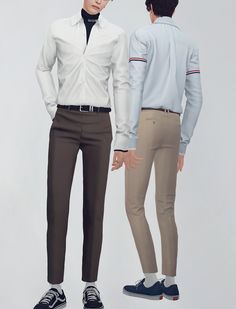 two people standing next to each other with their hands in their pockets and one person wearing white shirt and khaki pants