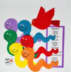 several different colored paper cut outs with birds and worms on them next to a sign that says, wiggly worms