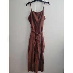 Elevate Your Beachy Bohemian Style With This Stunning Jumpsuit From Sanctuary Anthropologie. Made From 100% Cotton, This Lightweight And Breathable Sleeveless One-Piece Features A Square Neckline And Straight Leg Style With Pockets. Perfect For A Casual Summer Or Spring Occasion, This Jumpsuit Comes In A Beautiful Brown Color And Is Available In Size M. Hand Wash Only And Made In China, This Jumpsuit Is Perfect For Those Who Want To Look Effortlessly Stylish Without Sacrificing Comfort. With Its Sleeveless Linen Jumpsuits And Rompers For Day Out, Sleeveless Linen Jumpsuits For Day Out, Cotton Jumpsuits And Rompers For Beach Season, Cotton Jumpsuits And Rompers For Vacation, Cotton Beachwear Jumpsuits And Rompers For Beach Season, Summer Relaxed Fit Jumpsuits And Rompers With Tie Waist, Beach Fitted Jumpsuits And Rompers With Pockets, Fitted Beach Jumpsuits And Rompers With Pockets, Brown Summer Jumpsuits And Rompers