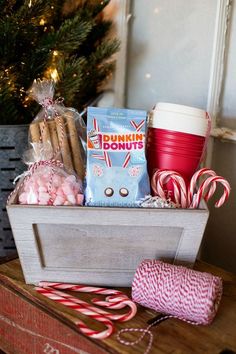 christmas morning coffee gift in a wooden box with candy canes, hot chocolate and marshmallows