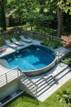 an above ground swimming pool with steps leading up to it and a deck in the middle