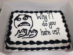 a cake that has been decorated with an angry face and words written on the frosting