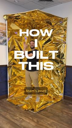 a man standing in front of a gold foiled wall with the words how i built this