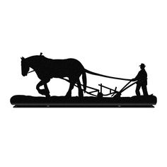 a horse drawn plow being pulled by a man