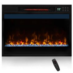 an electric fireplace with flames and remotes next to it, on a white background