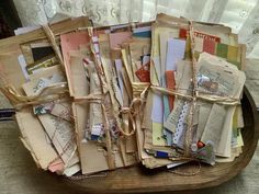 a wooden tray filled with lots of different types of papers