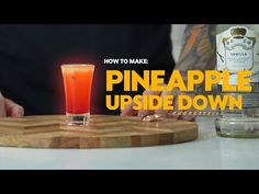 a person sitting at a table with a drink in front of him and the words how to make pineapple upside down