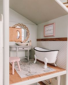 a bathroom with a claw foot tub and vanity