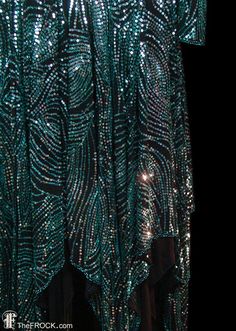 Halston 1970s sequined evening dress, hankie hem, blue / green teal color, plunging open back / back Fitted Green Flapper Dress For Party, Elegant Green Flapper Dress For Party, Sequin Dress For Dance And Party Season, Elegant Green Flapper Dress For Evening, Embellished Evening Dress For Festivals, Embellished Sequin Dress For Costume Party And Holiday, Embellished Green Sequin Dress For Party Season, Green Embellished Sequin Dress For Party Season, Glamorous Sequin Dress For Dance