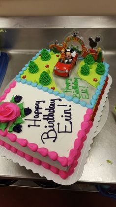 a birthday cake with mickey mouse and friends on it