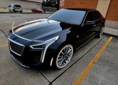 a black car parked in a parking lot