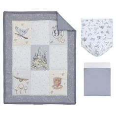 a baby blanket and bib set in grey with pictures on the front, including an owl