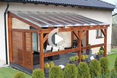 a house with a covered patio in the front and side yard area next to it