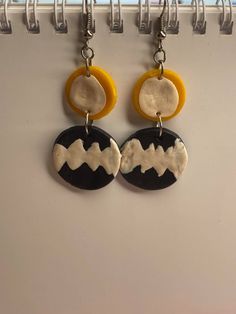 My Hero Academia Inspired Polymer Earrings.  Themed on Sero's Hero costume.  Handmade Black, White and Yellow Circle Geometric Earrings, Pattern design may vary slightly to the image due to being handmade. Made from Polymer clay, with Stainless steel. Artsy White Pierced Earrings, Artsy White Earrings, Artistic Yellow Jewelry With Matching Earrings, Artsy Dangle Pierced Earrings, Artsy Yellow Jewelry With Ear Wire, Artsy Yellow Dangle Jewelry, Handmade Yellow Circle Earrings, Unique Yellow Dangle Earrings, Artistic White Round Earrings