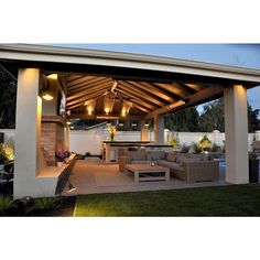 an outdoor living area with couches and tables under a wooden roof over looking a swimming pool