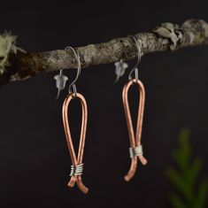 These limited edition hammered earrings are handcrafted with mixed-metal on hypoallergenic niobium hooks. Made in a small batch so each pair has slight variations. Features Vegan and hypoallergenic Coated for tarnish resistance Long lasting and well crafted Solid metals, never plated 100% handcrafted by the artist Details Earring Size - 50 mm long x 8 mm wide Materials - Pure copper, sterling silver, Niobium hooks, silicone backers Weight - Light to medium, comfortable Jewelry Care Jewelry care Hammered Wire Jewelry Diy, Hammered Wire Jewelry, Mixed Metal Earrings, Carnelian Jewelry, Jasper Jewelry, Hammered Earrings, Earring Designs, Bronze Jewelry, Diy Wire Jewelry