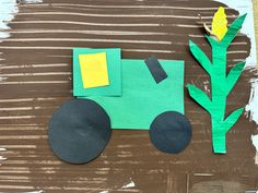 a paper flower and tractor made from construction paper