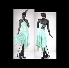 "Description  A beautiful 1920s style flapper strapless blue green chiffon handkerchief dress.  The dress has a ruched and boned bodice with vertical ribbon trim that laces up in the back and goes to a defined drop waist. The skirt is made up of 3 layers of chiffon and a matching slip that extends up and also lines the bodice, with a centre back zip, a ribbon bow on each hip with long tails, and pointed handkerchief ends around the hem.  The skirt is made with chiffon edged in matching satin rib Fitted Flapper Dress For Summer Costume Party, Fitted Summer Flapper Dress For Cocktail, Fitted Flapper Dress For Summer Cocktail, Fitted Summer Cocktail Flapper Dress, Fitted Summer Flapper Dress For Evening, Fitted Flapper Dress For Spring Costume Party, Spring Flapper Dress For Costume Party, Fitted Vintage Flapper Dress For Summer, Fitted Green Flapper Dress For Party