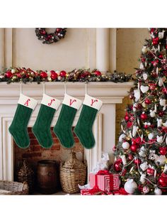 three christmas stockings hanging from a fireplace