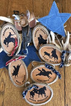 several cowboy themed items are arranged on a wooden table with blue star and other decorations