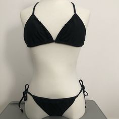 American Eagle String Bikini With Ruffle Details Top Triangle Top Halter Style. Light Removable Padding. Size Small - Nwot Bottoms With Side Tie. Ruffle Details On Front Only. Size Extra Small - Nwt Black Triangle Halter Top For Sunbathing, Black Triangle Top Swimwear, Black Triangle Top Lined Swimwear, Black Fitted Tie-side Swimwear Bottom, Black Triangle Top Swimwear, Bra Friendly, Black Bra-friendly Triangle Top Swimwear, Full Coverage Swimsuit, Black Top, Bathing Suit Bottoms