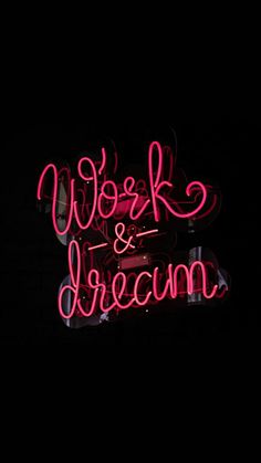 a neon sign that says work and dream