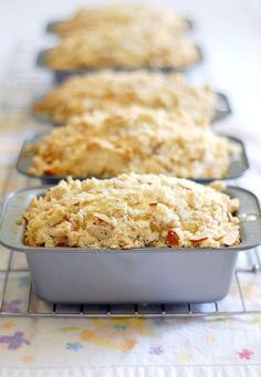 three pans filled with food sitting on top of a table