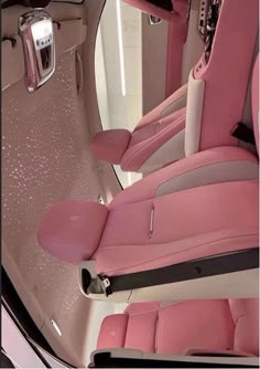 the interior of a car with pink leather seats