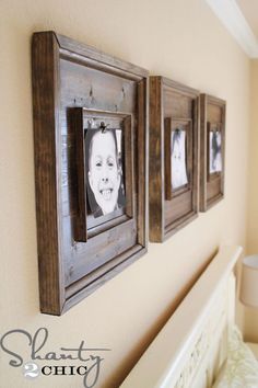 three framed pictures hang on the wall above a bed