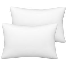 two white pillows sitting next to each other