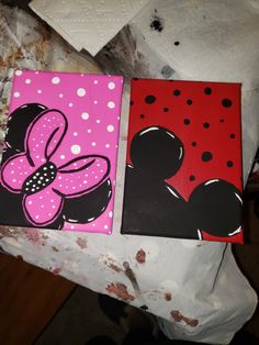 two paintings of mickey and minnie mouse on canvases