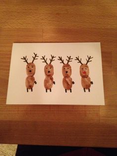 three reindeer stickers on a piece of paper in the shape of four different faces