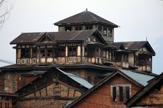 an old building with lots of windows on top of it