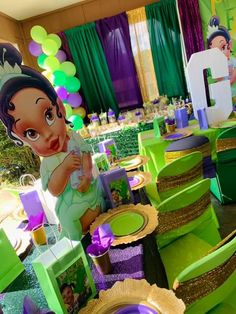 a table set up for a princess and the frog birthday party