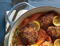 a pot filled with meat and vegetables on top of a table