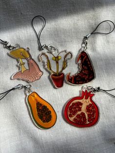 four key chains with different designs on them