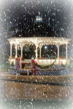 the gazebo is decorated with christmas lights and decorations