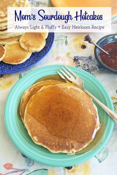 there is a plate with pancakes on it and syrup in the bowl next to them