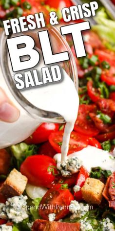 fresh and crisp blt salad with dressing being poured onto it