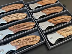 six knives are in a box with engraved names on them, and one is open to show the contents