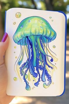 a drawing of a jellyfish on a notebook